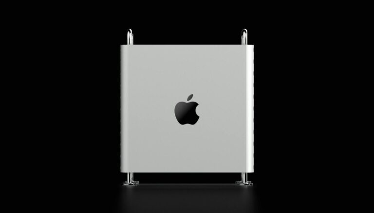 silver macbook with black background