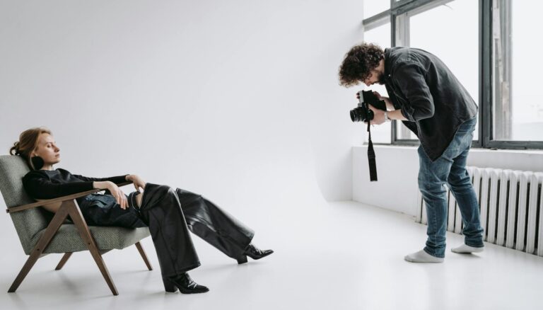 model reclining on a chair at a photo session