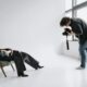 model reclining on a chair at a photo session