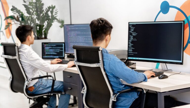 people using computers at work