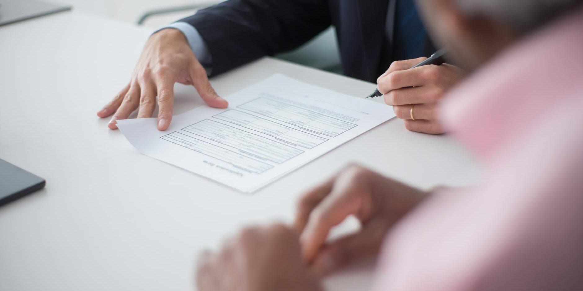 elegant man signing documents