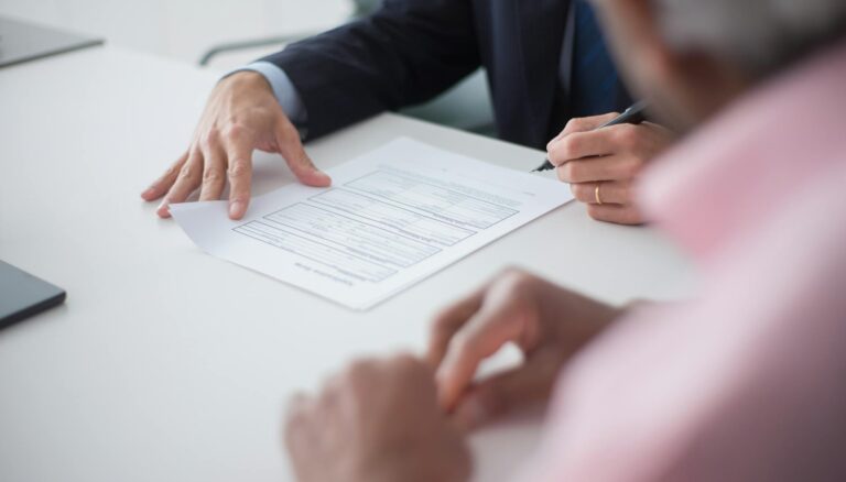 elegant man signing documents
