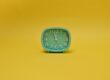 an alarm clock with yellow background