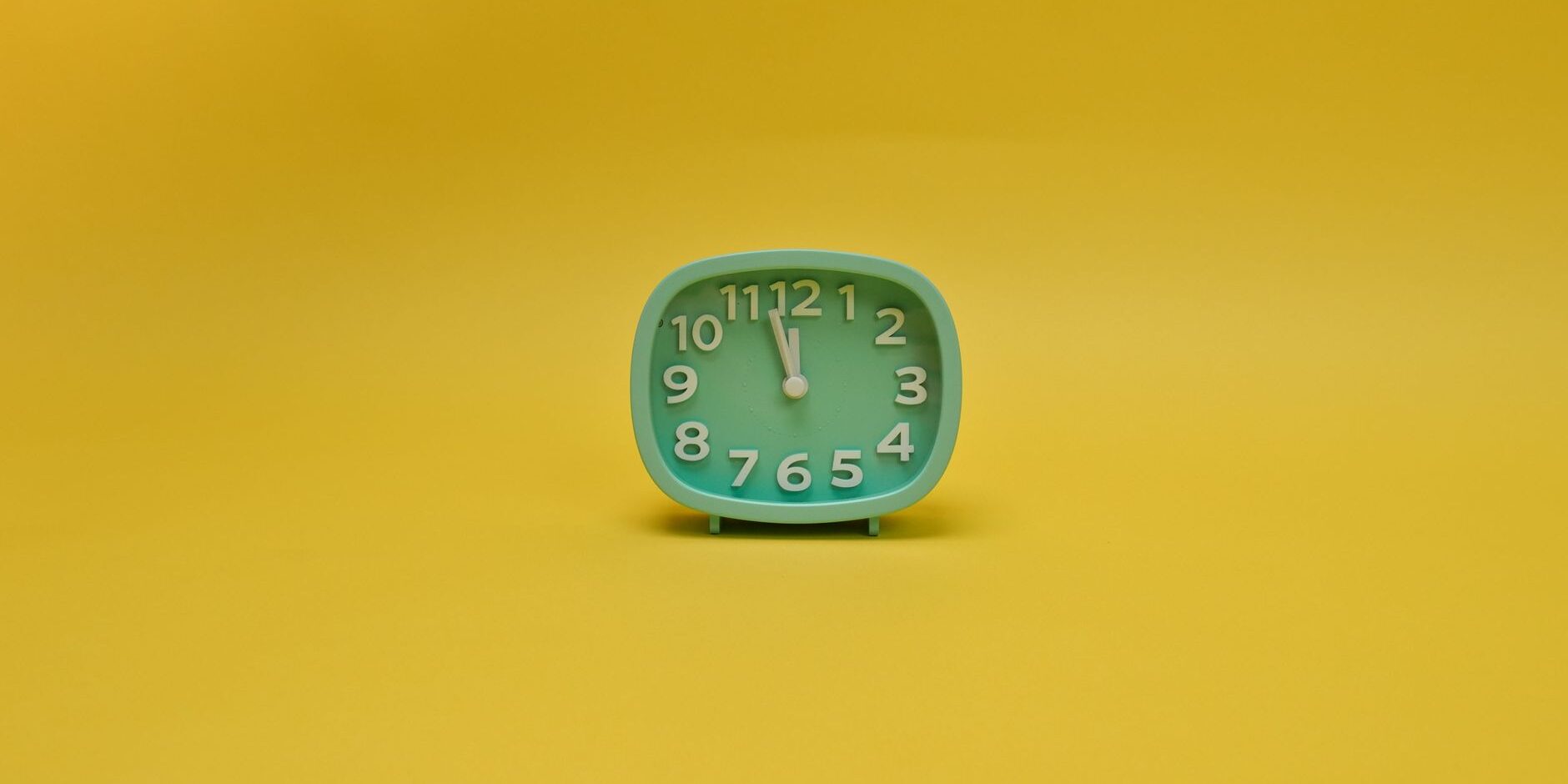 an alarm clock with yellow background