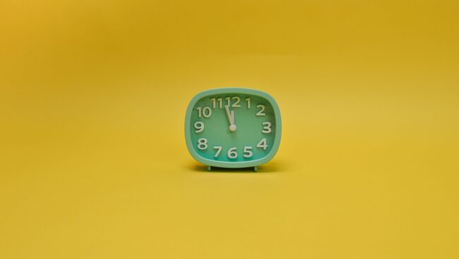 an alarm clock with yellow background