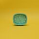 an alarm clock with yellow background