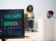computer monitor with stock exchange figures in an office