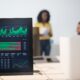 computer monitor with stock exchange figures in an office